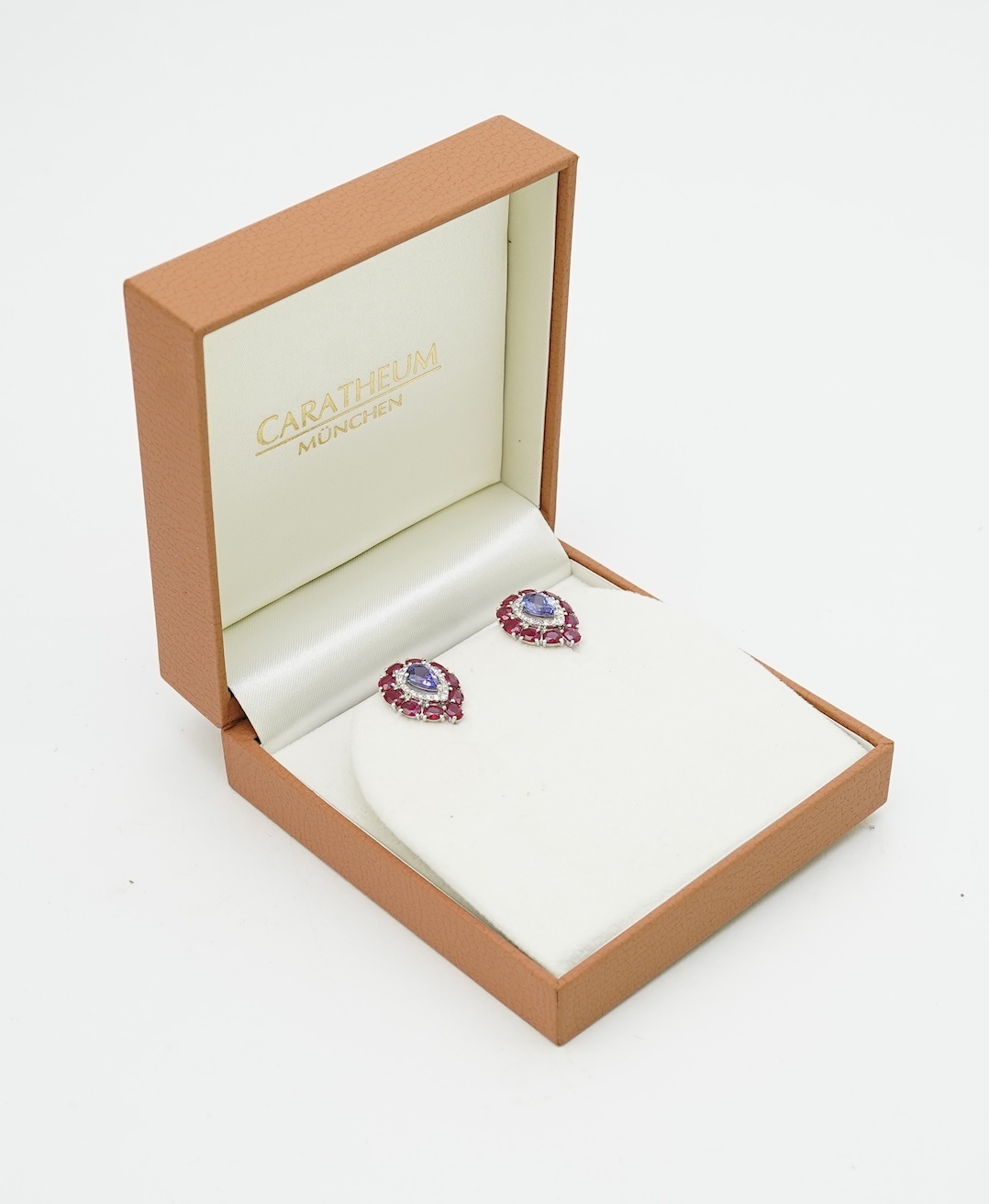 A pair of tanzanite, ruby and diamond earrings